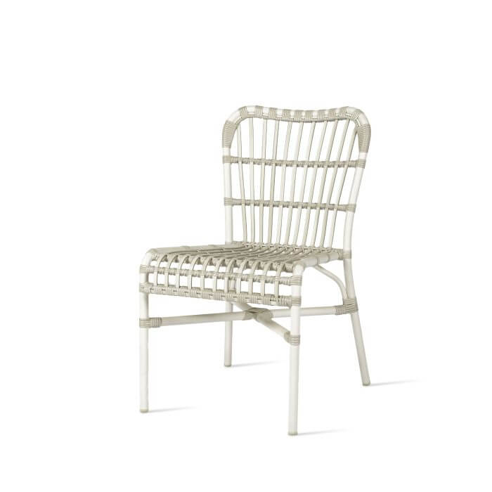 Experience the allure of this exquisite white aluminium dining chair, featuring an intricate woven design.