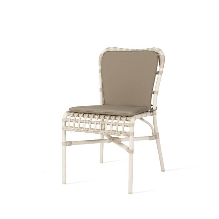 Experience outdoor dining in style with this chic off white aluminium dining chair, complete with a cozy taupe cushion for a touch of luxury.